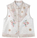 Front product view of the porcelain white vest with a stand collar, embroidered front panel and pink buttons.