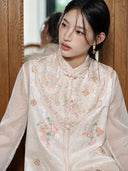 Close-up of the model wearing the vest, highlighting its stand collar and embroidered front panel.