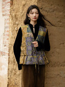 Front view of the Moxu vest’s patterned side with a V neckline, button fastenings and gathered hem.