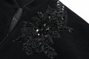 Close-up of black beads and sequins forming a floral design on the wool coat.
