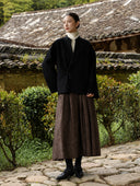 Full-length outfit with the Jinyu Black wool coat, brown skirt and black shoes.