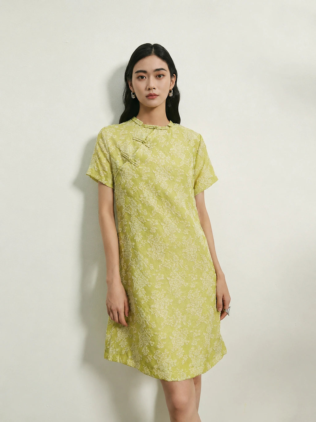 Women's light green 100% mulberry silk floral shift dress with handcrafted frog buttons and round neckline.