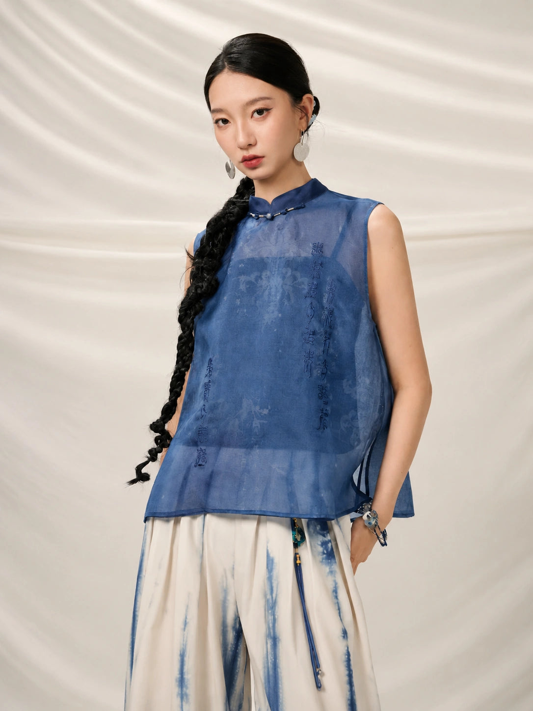 Woman wearing the Mulberry Silk Mandarin Collar Sleeveless Top by Gambiered Silk.