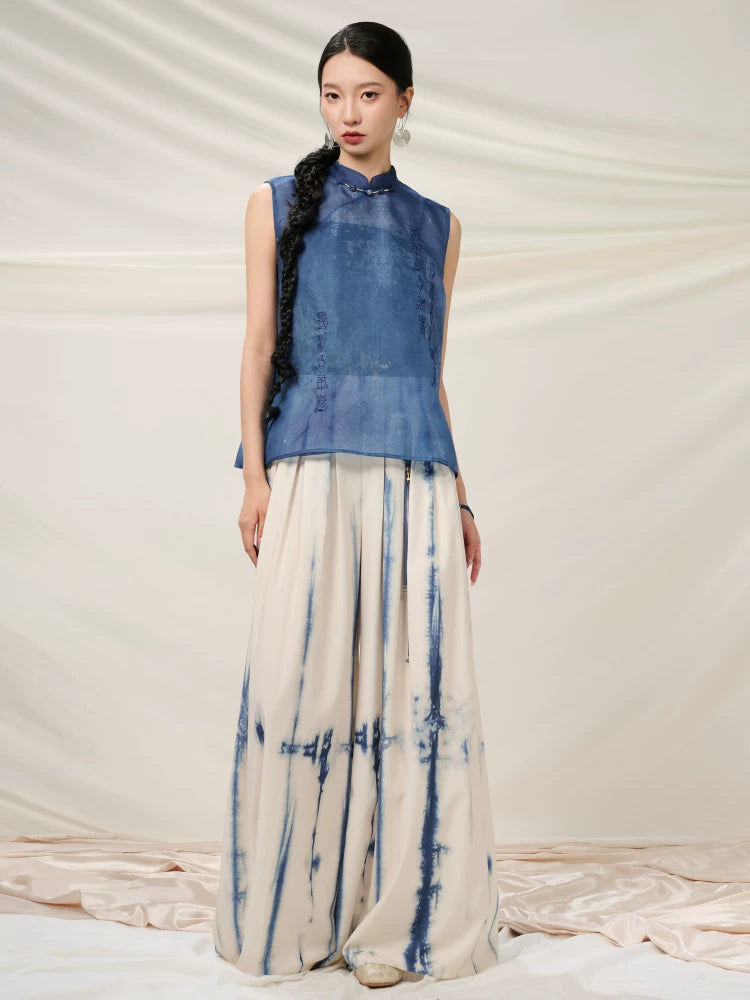 Full-length styling of the Mulberry Silk Sleeveless Top paired with hand-dyed wide-leg trousers.