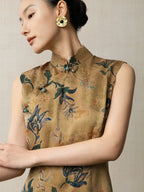 Close-up of the mandarin collar and handcrafted frog buttons on a floral silk qipao