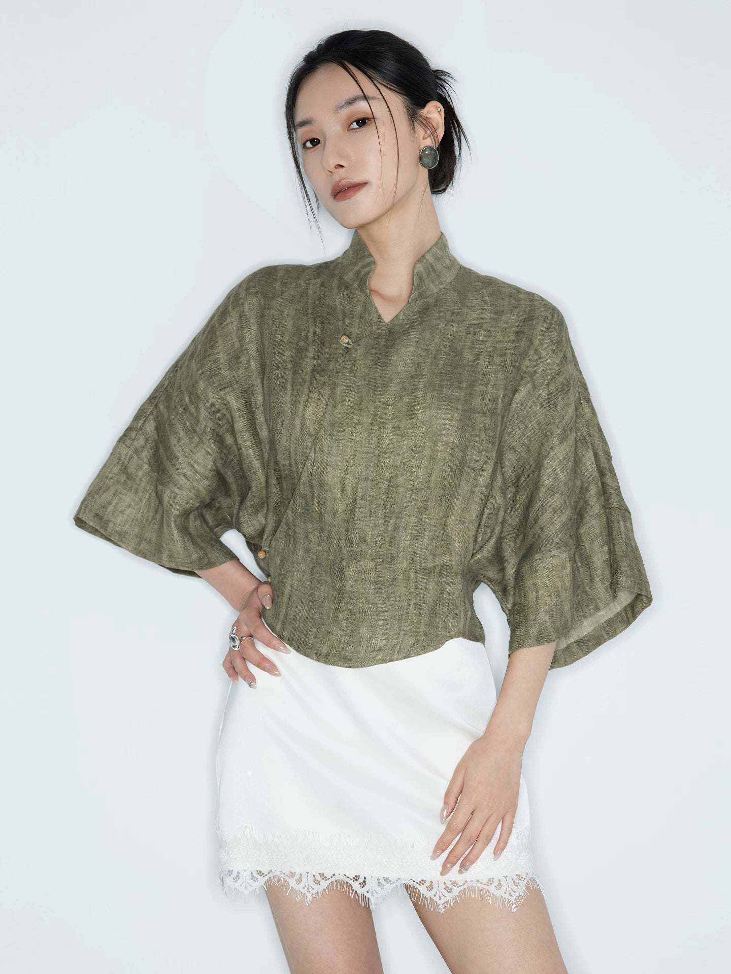 Olive Green Linen Mandarin Collar Blouse styled with a white skirt for everyday wear.