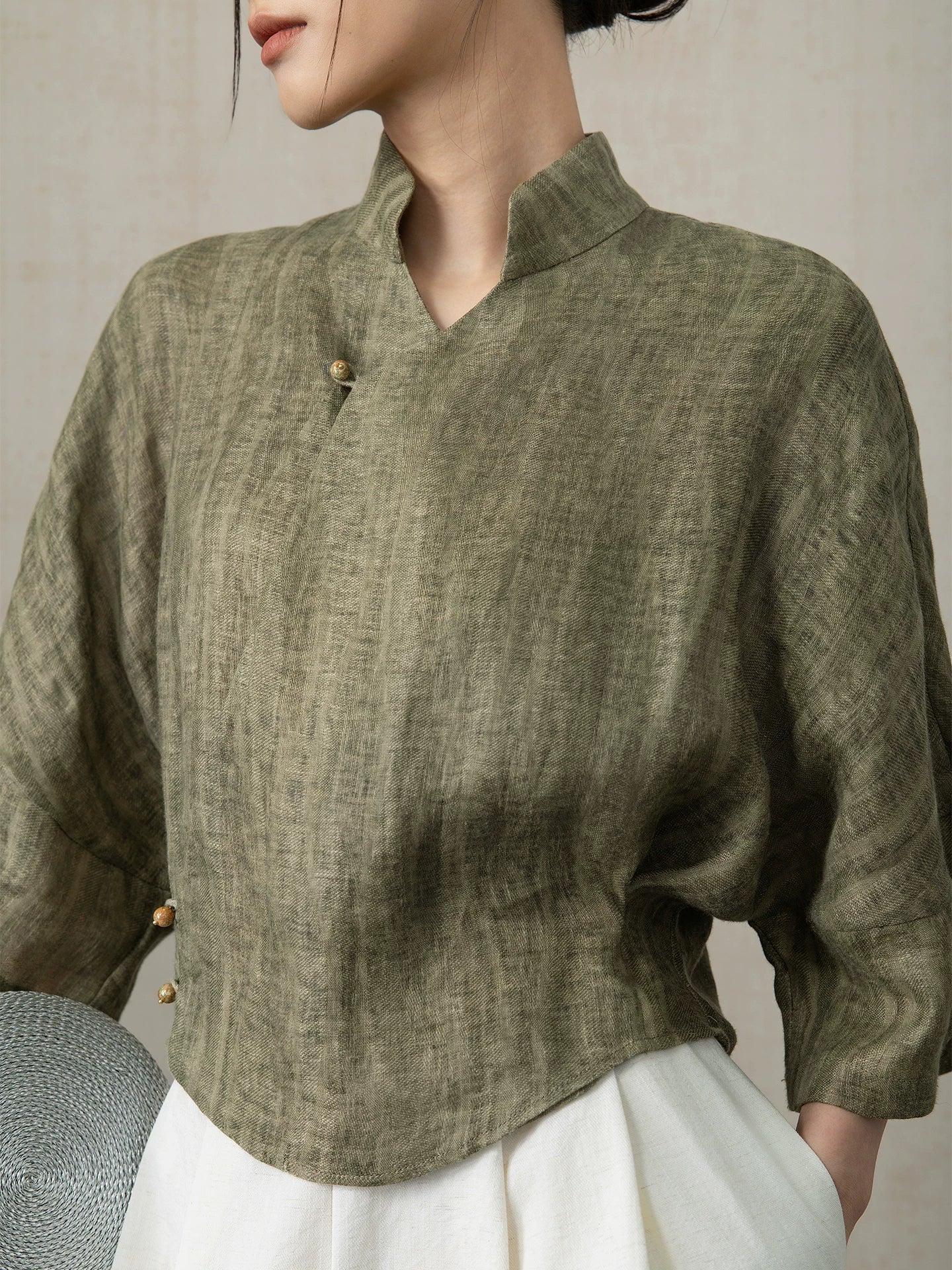 Close-up of the Olive Green Linen Mandarin Collar Blouse showing the premium linen texture.