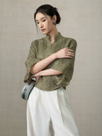 Side view of the Olive Green Linen Mandarin Collar Blouse in premium linen.