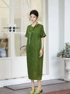 Model wearing an olive green 100% mulberry silk new Chinese dress with a stand collar