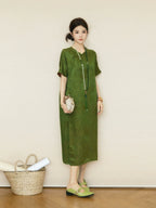 Full-length view of an olive green silk dress with a relaxed H-line silhouette and regular sleeves