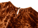 Detail of the copper-orange dress’s buttoned back keyhole
