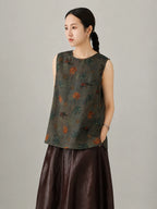 Side view of women's Xiangyunsha silk sleeveless top with relaxed silhouette and oriental elephant print pattern