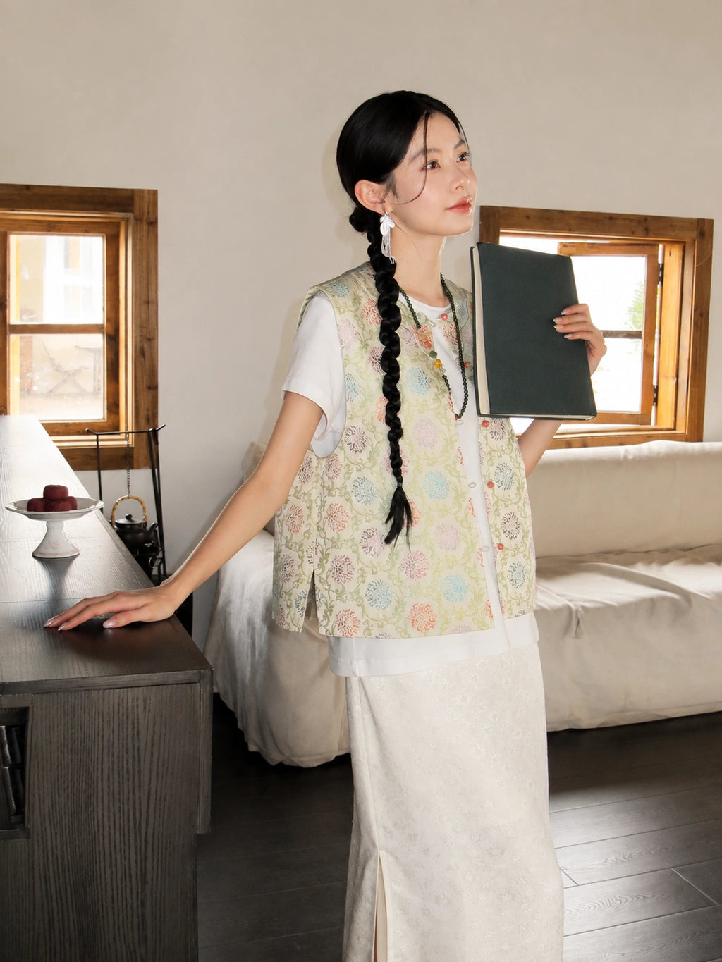 Side view of a lightweight floral mulberry silk vest with a relaxed Chinese-inspired silhouette.