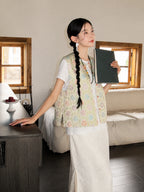 Side view of a lightweight floral mulberry silk vest with a relaxed Chinese-inspired silhouette.