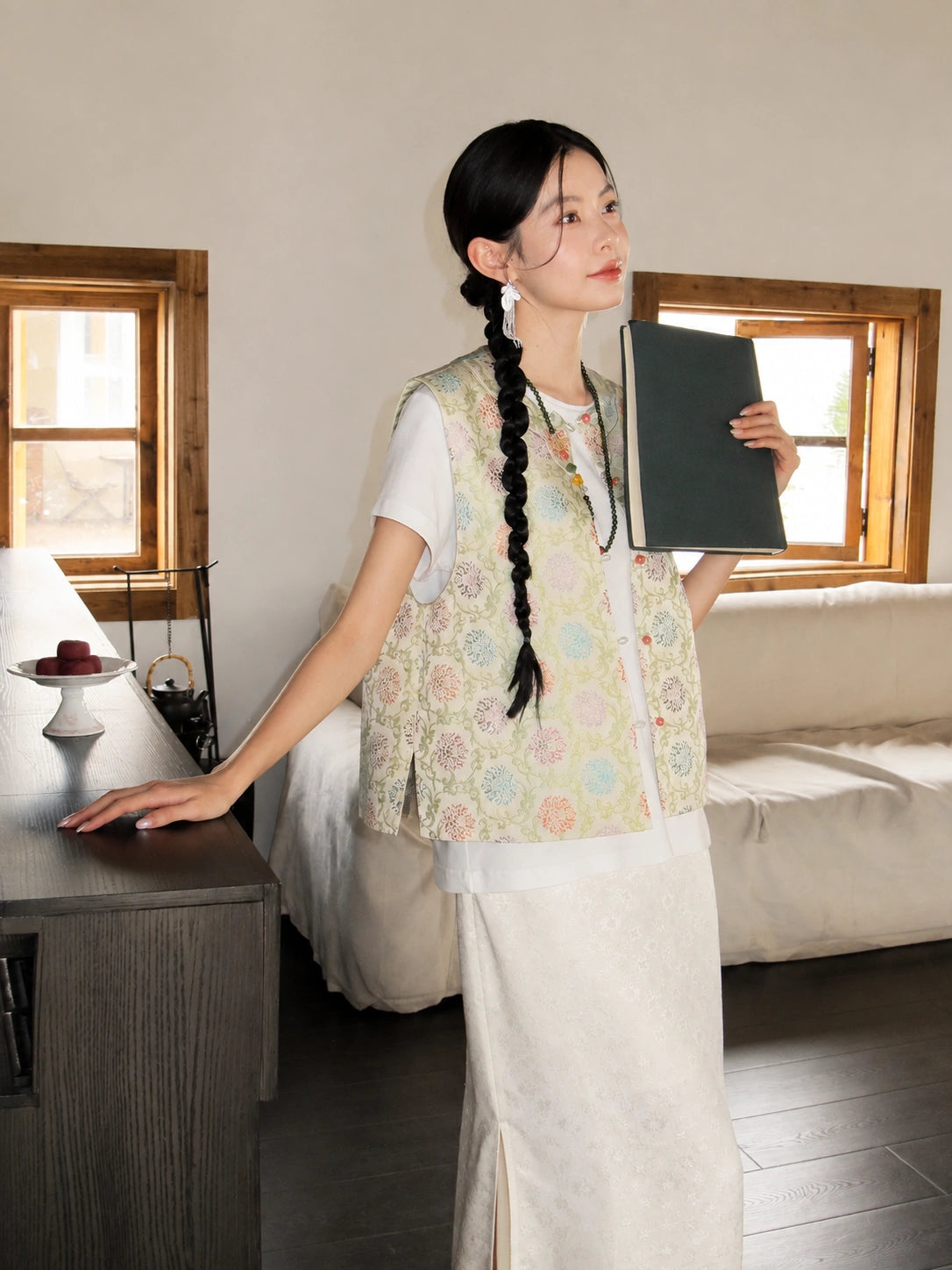 Side view of a lightweight floral mulberry silk vest with a relaxed Chinese-inspired silhouette.