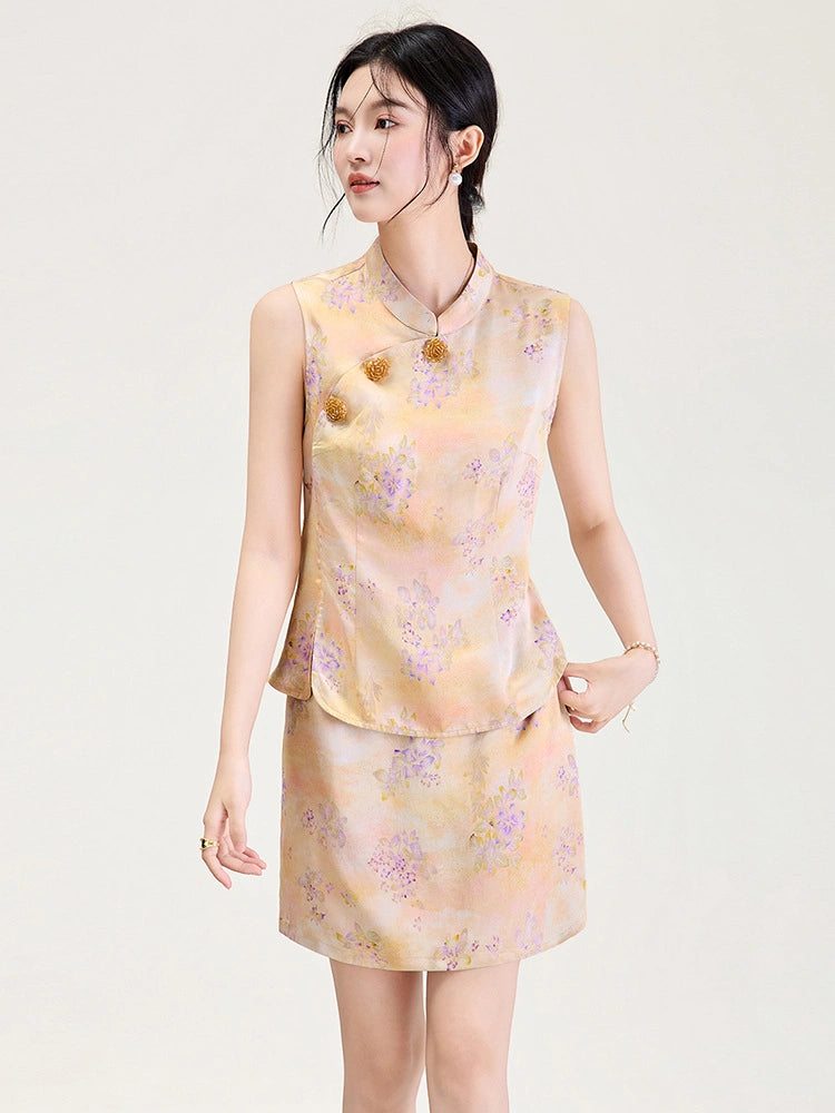 Model wearing a peach floral viscose top and skirt set with a Mandarin collar and decorative gold buttons.