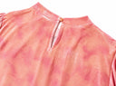 Detail of the back neckline button and keyhole opening