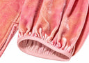 Close-up of the gathered cuff and softly mottled pink fabric
