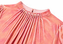 Detail of the fine neckline pleats and pearl-like accents
