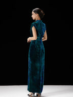 Back view of women's peacock teal velvet qipao dress with graceful fitted silhouette.