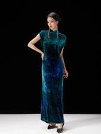 Women's peacock teal velvet qipao dress with mandarin collar and elegant slim silhouette by Gambiered Silk.