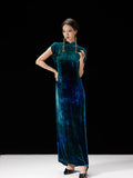 Peacock teal velvet-inspired qipao dress styled with traditional frog-button details.