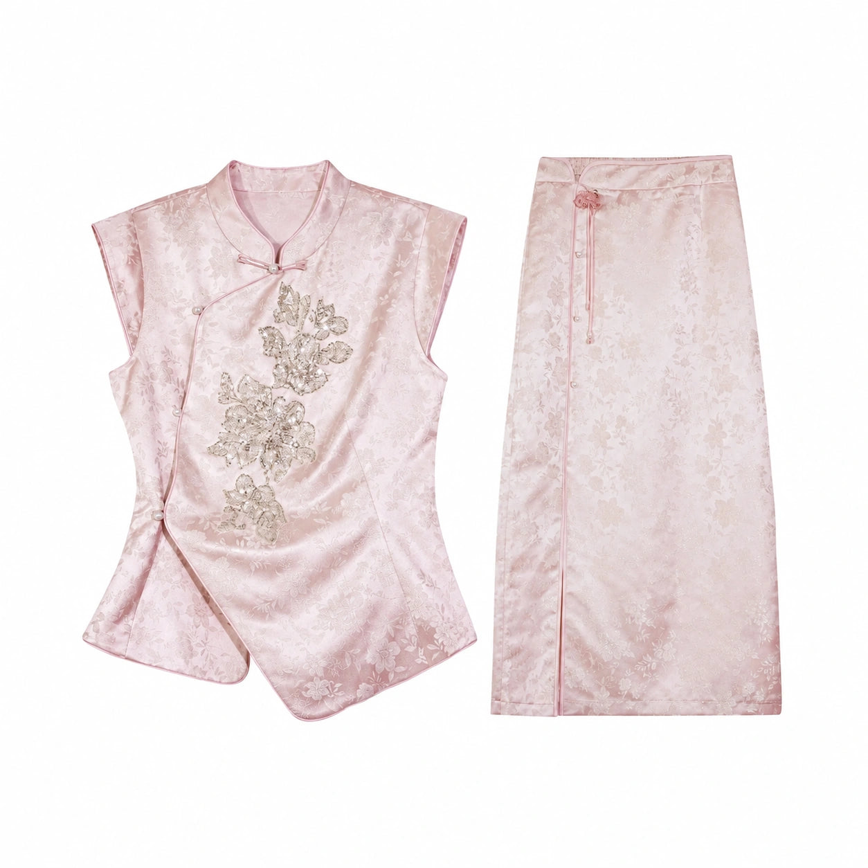 Flat lay of a pink Cheongsam set featuring a cap-sleeve top with a mandarin collar and silver sequin floral embroidery, paired with a matching midi skirt.