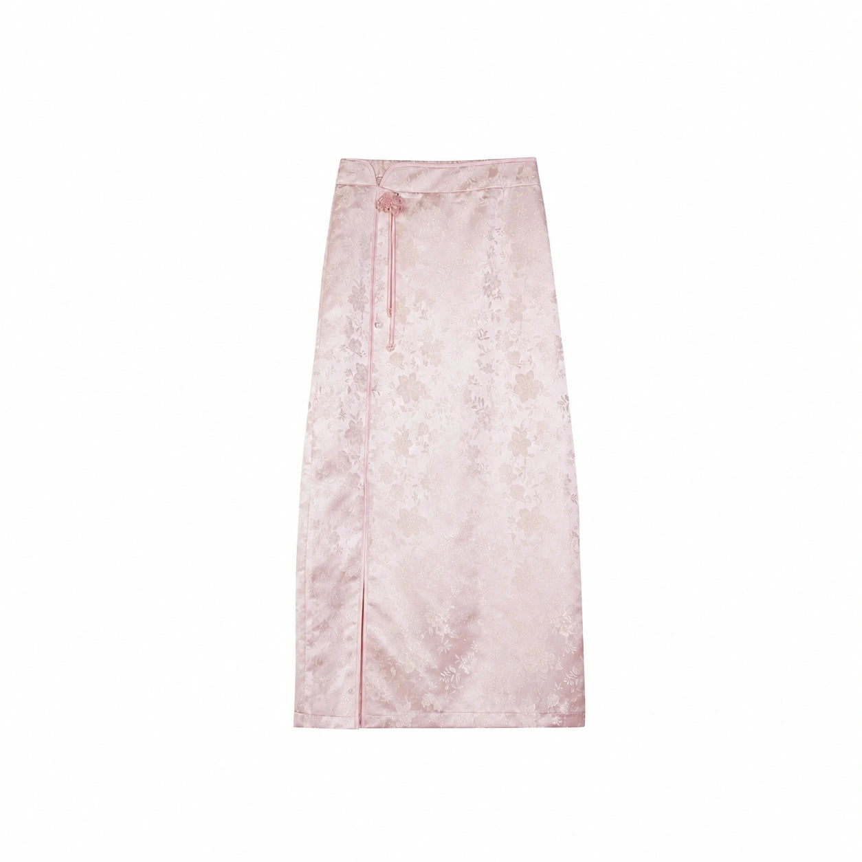 Flat lay of a pink midi skirt with floral jacquard pattern and side button details, matching the embroidered top.