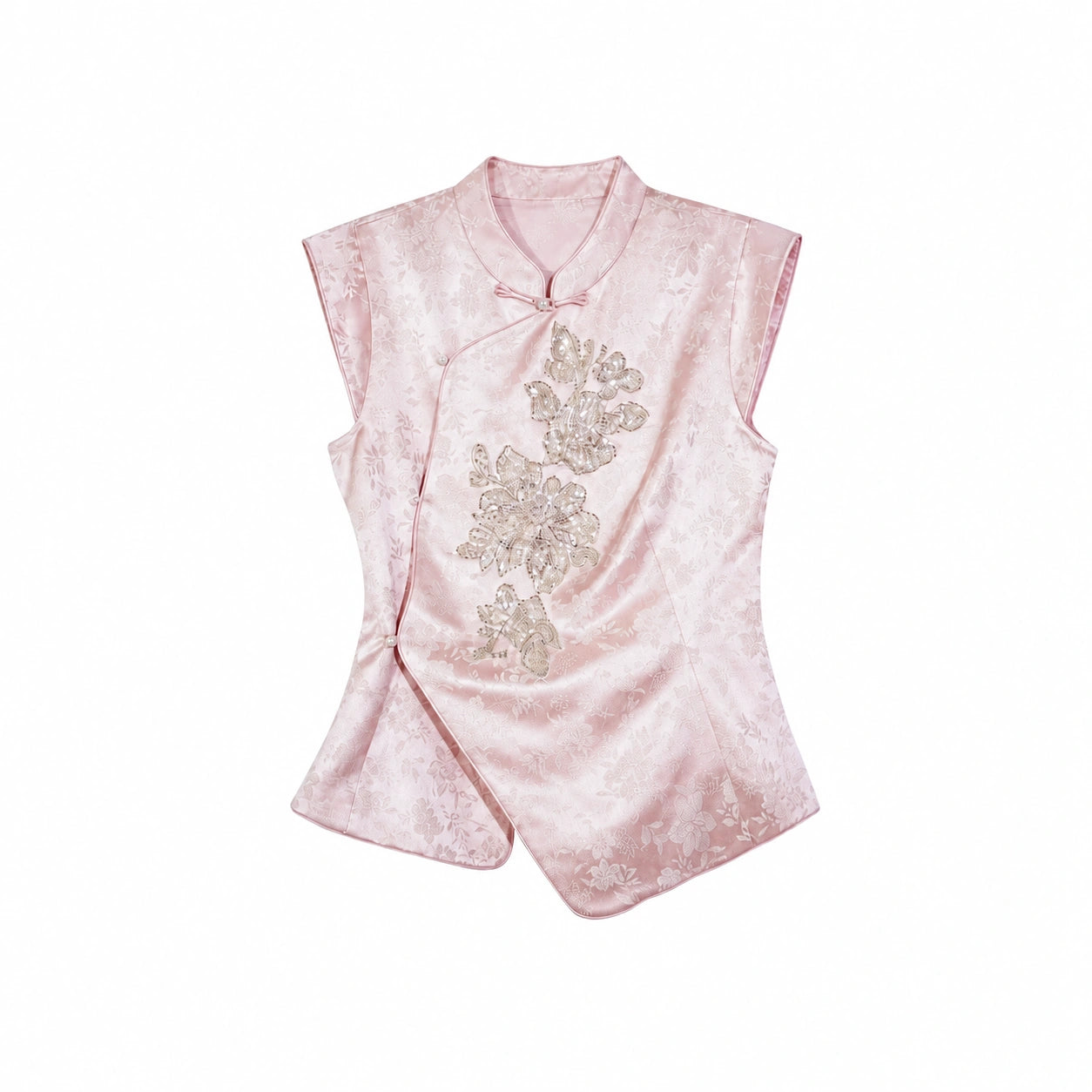 Flat lay of a pink cap-sleeve Cheongsam top with a mandarin collar, silver sequin floral embroidery, and an asymmetric hem.