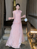 Model wearing a pink sleeveless Cheongsam dress with floral embroidery, beaded trim, and a pleated skirt, holding a white handbag, crafted from 100% polyester.