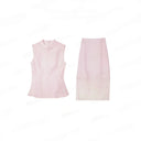 Flat lay of a light pink women's Cheongsam set with a sleeveless top and a matching A-line skirt, featuring floral embroidery.
