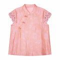 Flat lay of a pink jacquard blouse with a mandarin collar, lace cap sleeves, and a side button closure, crafted from 80% Viscose and 20% Polyamide.