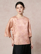 Front view of a women's New Chinese Style pink-gold silk shirt with a diagonal placket and delicate butterfly jacquard texture.