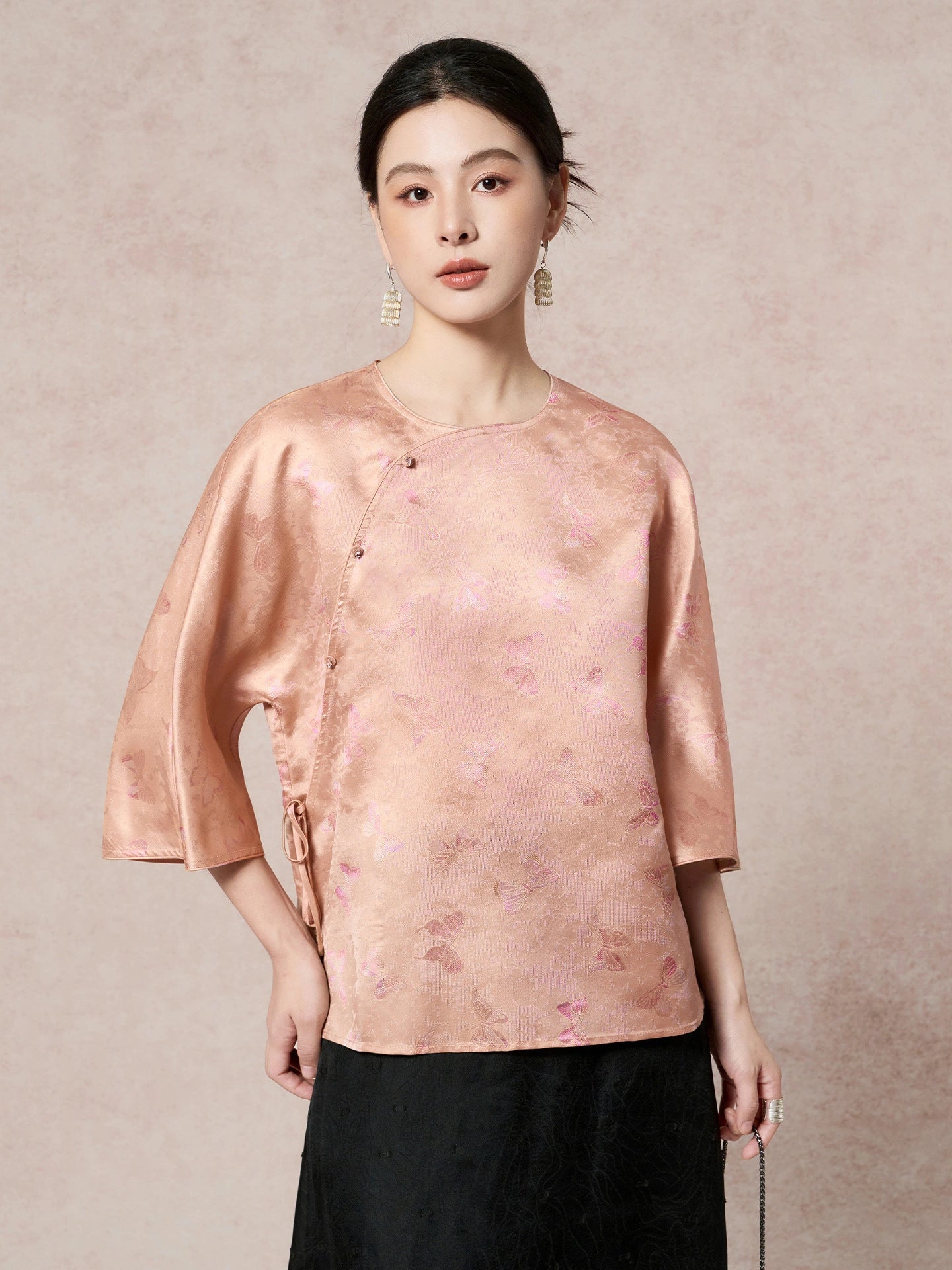 Front view of a women's New Chinese Style pink-gold silk shirt with a diagonal placket and delicate butterfly jacquard texture.
