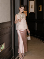 Model wearing a pink jacquard Cheongsam vest with a pearl-trimmed collar, holding a fan and handbag, showcasing the elegant 70% Polyester and 30% Lyocell blend.