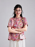 Front view of the Gambiered Silk pink koi floral top with stand collar and frog-button details