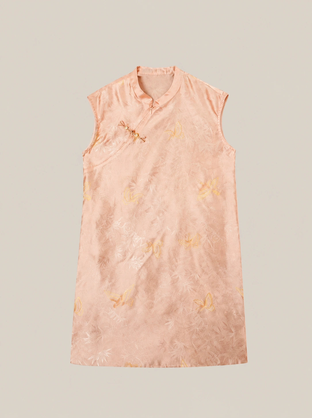 Pink mulberry silk sleeveless dress featuring Chinese knot button detail and elegant jacquard texture