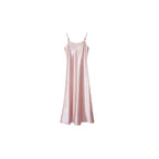 Flat lay of a soft pink satin slip dress with thin straps and a relaxed fit, ideal for layering, made from 100% polyester.