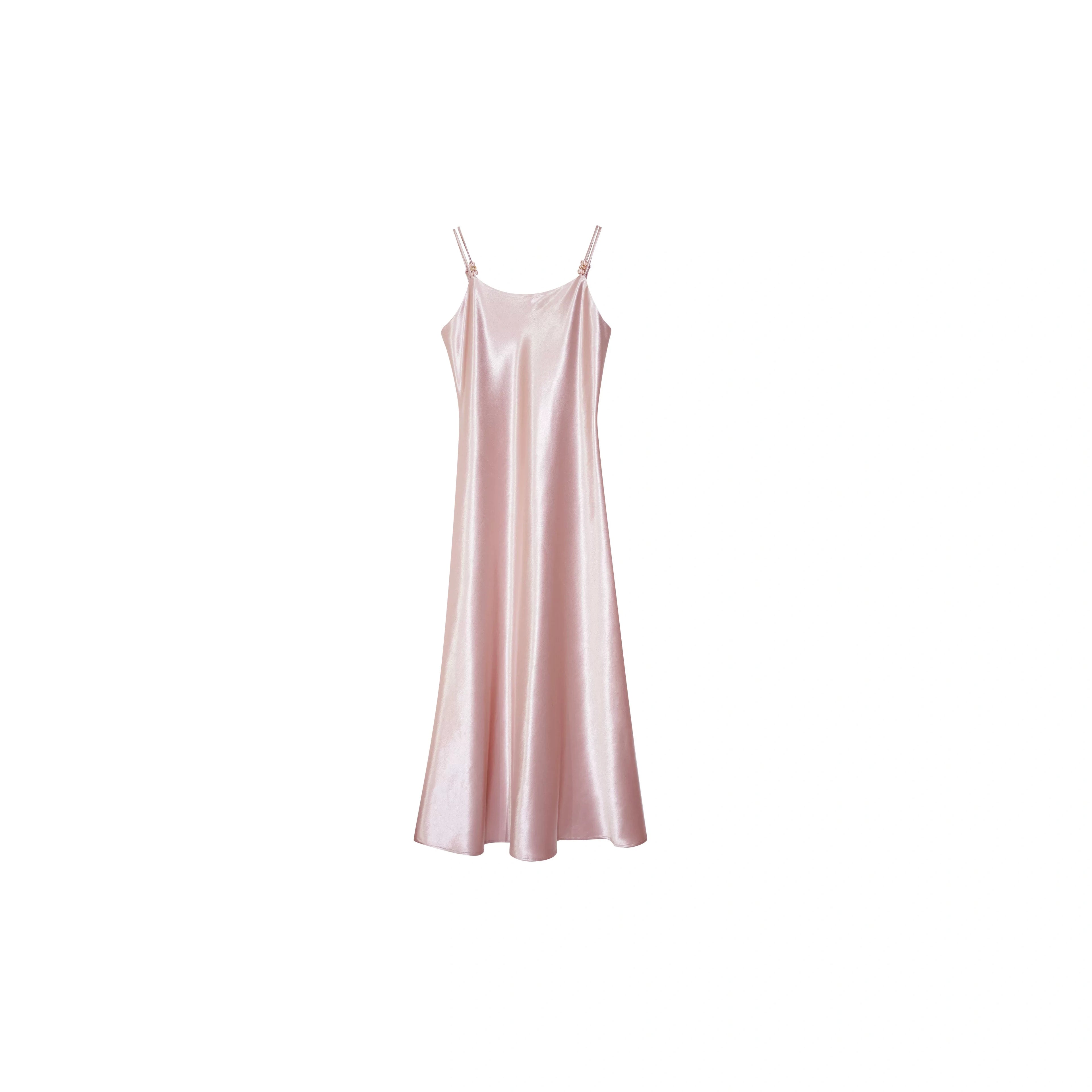Flat lay of a soft pink satin slip dress with thin straps and a relaxed fit, ideal for layering, made from 100% polyester.