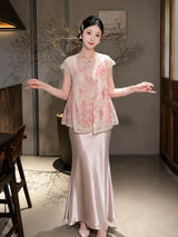 Model wearing a pink sheer Cheongsam vest with floral embroidery and gold buttons, standing with open arms, crafted from 100% polyester.