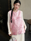 Front view of a 100% mulberry silk pink vest with traditional knot closures and delicate bamboo, plum, and peach patterns.