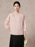 Front view of a women's pink New Chinese Style silk top with a round neckline and diagonal placket, crafted from 93.8% mulberry silk, featuring a relaxed fit and elegant drape.