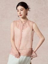 Side view of a pink silk vest featuring a relaxed fit, sheer fabric, and intricate embroidery details at the hem.