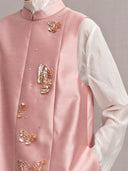 Close-up of the pink vest’s stand collar and embellished butterfly front panel