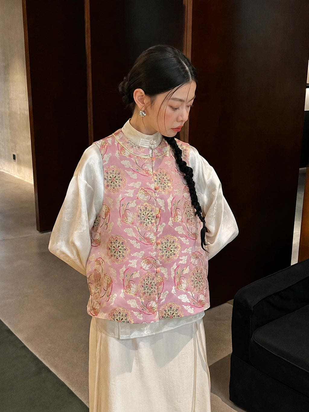 Front view of the pink Song brocade silk vest with jade rabbit and lotus-inspired gold-thread patterns