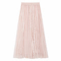 Flat lay of a pink pleated tulle maxi skirt with elastic waistband and delicate lace panels throughout, crafted from 100% polyester.