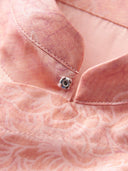 Close-up of the concealed snap closure and interior construction of the pink viscose blouse.