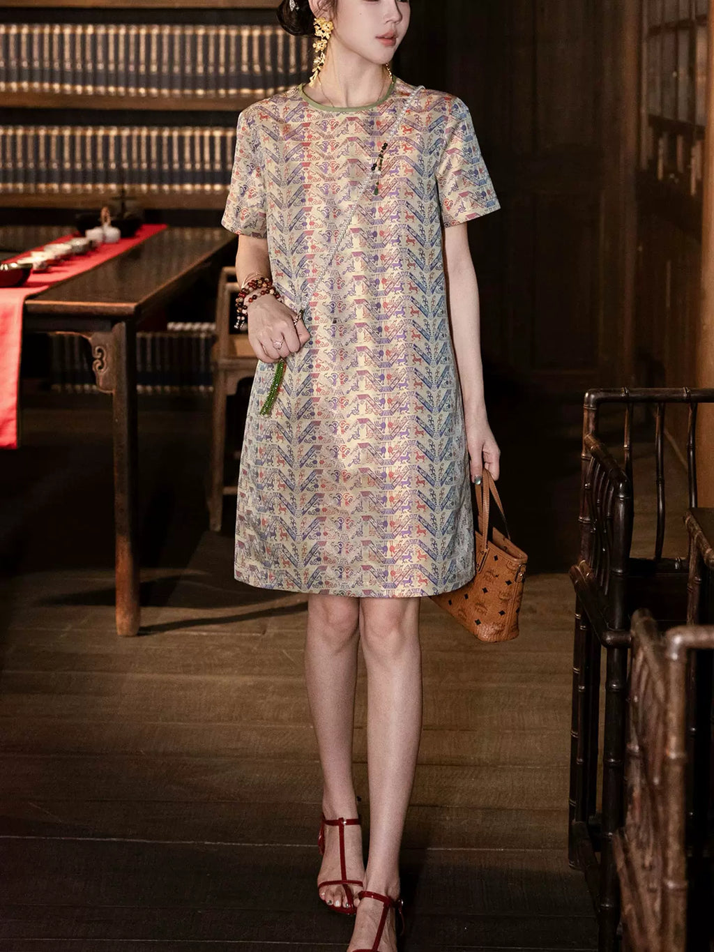 Full-length view of a model in a relaxed pure silk Chinese-inspired dress with short sleeves