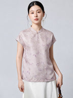 Model wearing a light purple 94% mulberry silk top with a stand collar, asymmetrical button placket, and butterfly jacquard pattern, paired with a white skirt.