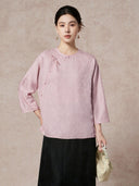 Model wearing a light purple 93.8% mulberry silk blouse with a round neckline, diagonal placket, and intricate jacquard weaving, paired with a black skirt, showcasing a sophisticated New Chinese style look.